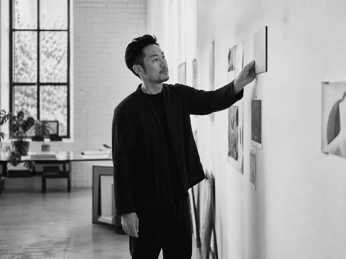A person placing the first visible proof of their progress on a wall