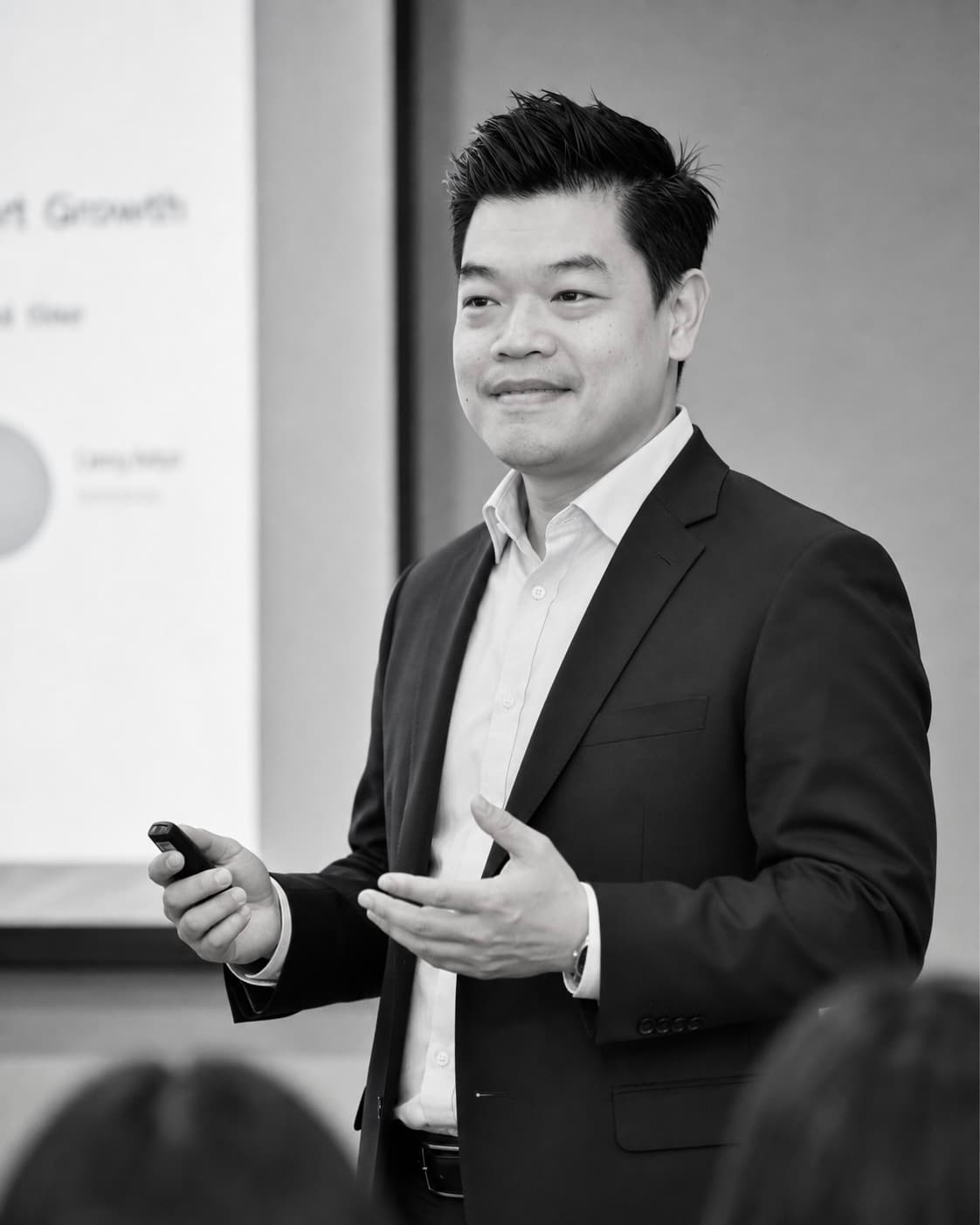 Tom Jakkapat presenting to a group in a tutorial room